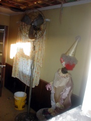 This scary clown inside the front building building.