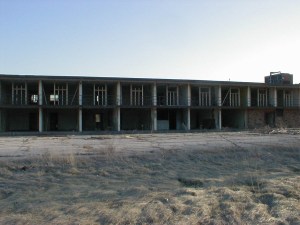 Looking into the former guest rooms from the north side parking lot. All of the metal and glass facade is missing, as are all of the furnishings.