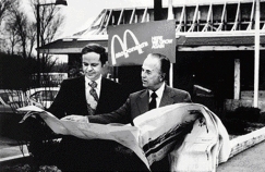 At left, Ray and his right-hand man, Fred Turner, look over the plans for a new McDonald’s of the same design as the Lebanon store.