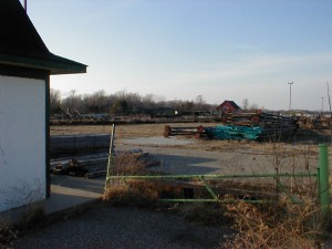 The parking lot entrance ticket shed, with disassembled ride in the foreground, and the main ticket windows in the distance.
