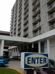 sheraton9large City employees use the driveway under the tattered awning of the hotel as extra parking.