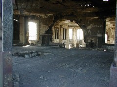 station7large Looking inside the main building from the East portals. There is fire damage here to the wood framing and floor - not safe to walk on.